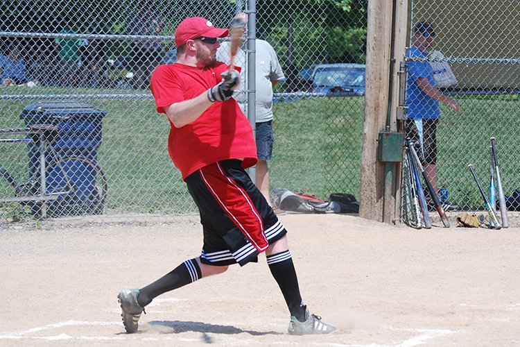 Photo of Dr. Eric Becker playing softball on the Faculty/Residency Softball Team.