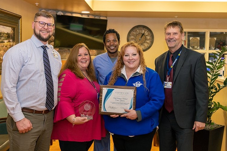 Photo of Gladwin employees accepting award