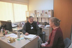 Photo of Pete Jackson, program coordinator for Healthaccess offering support to a patient.