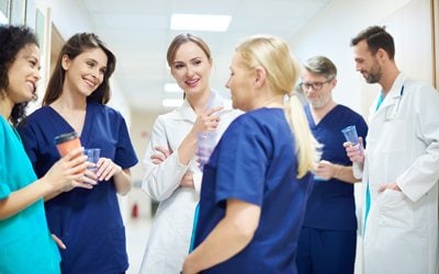 A team of nurses and doctors enjoying working together in a hospital setting