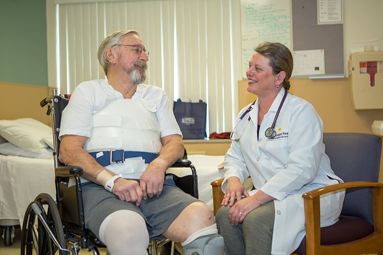 Photo of Dr. Meyer with RehabCentre patient.