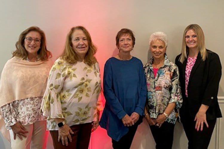 Group photo of the four women who planned the 2024 event.