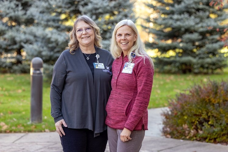 Photo of Penny Sauer on the left and Tina Parsons, wellness coach and manager of employee wellness, on the right.