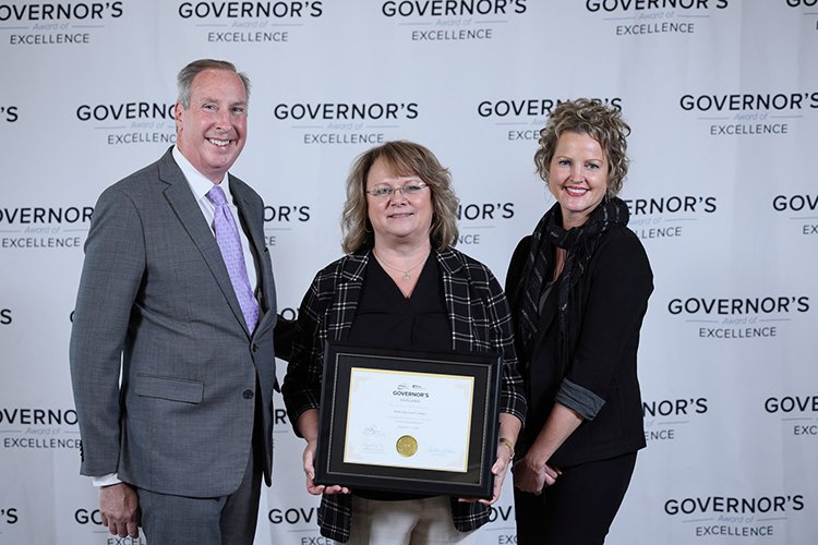 Photo of the Gladwin Quality Team holding the award.