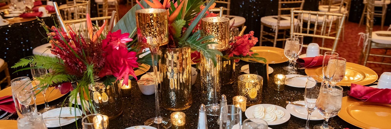 Photo of red and gold colored place setting.