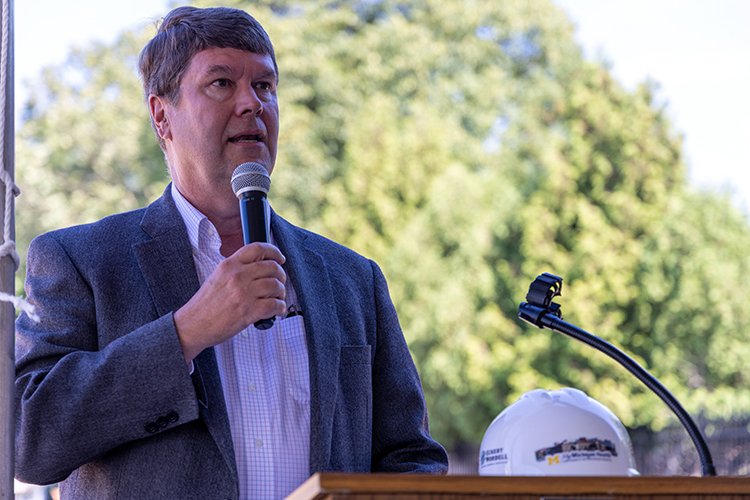 Photo of Bill Henderson, chair, MyMichigan Health Foundation, addressing the crowd at the Alma Surgical Services Groundbreaking event.