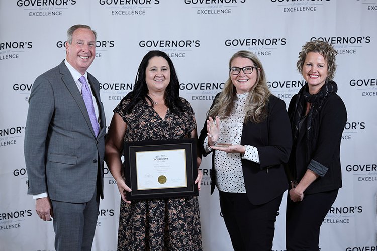 Photo of the Sault Quality Team holding the award.