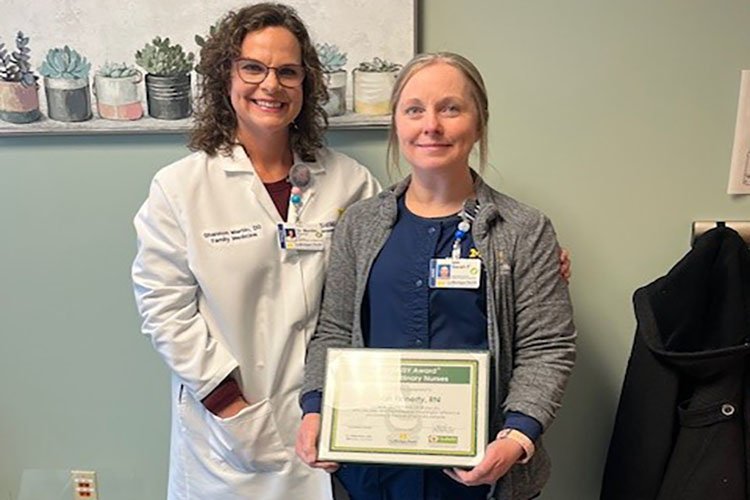 Photo of Dr. Martin and Sarah Finnerty, accepting the Daisy Award