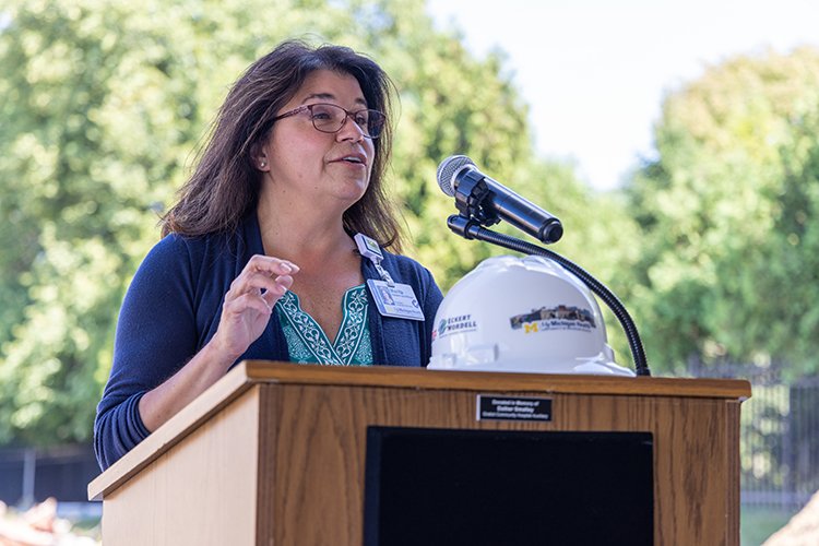 Photo Marita Hatten-Schiffman addressing the crowd at the Alma Surgical Services groundbreaking event.