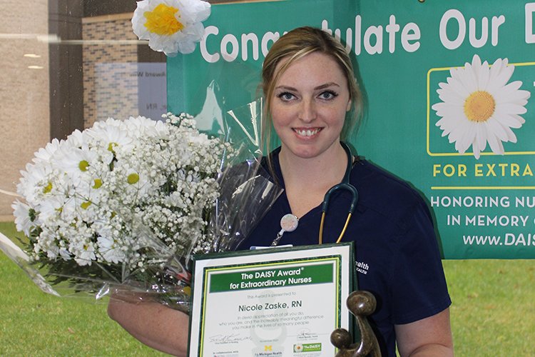 Photo of RN Nicole Zaske, accepting the Daisy Award.